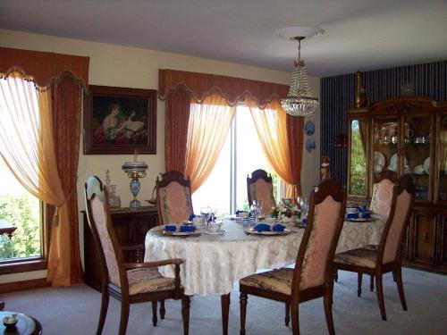 a dining room with a table and chairs at Oceanhillside B&B in Digby