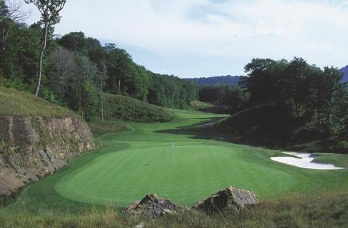 a view of a golf course with a green at Inn at Snowshoe in Snowshoe