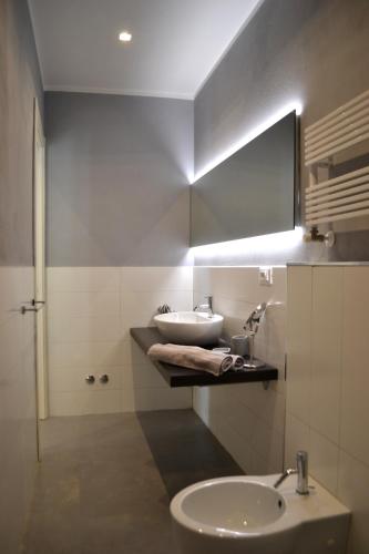 a bathroom with a sink and a mirror at A Casa Mia in Levanto