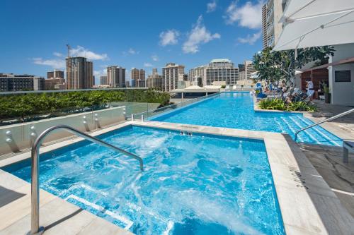 The swimming pool at or near Real Select at The Ritz-Carlton Residences, Waikiki Beach