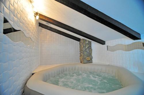 a bath tub in a bathroom with at Holiday Home Casa Bianca in Malinska