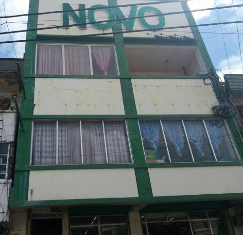 a green and white building with a noo sign on it at Asia Novo Boutique Hotel - Catbalogan in Catbalogan