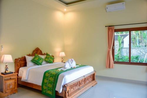 מיטה או מיטות בחדר ב-Sukun Babonsay Villas