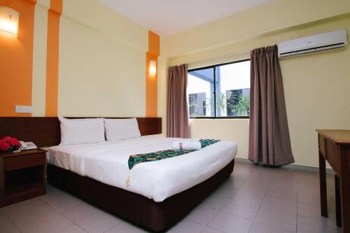 Katil atau katil-katil dalam bilik di Sun Inns Hotel Sitiawan