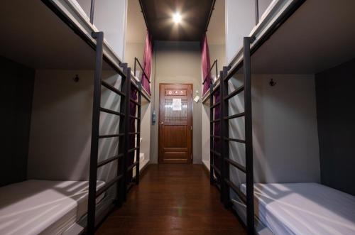 Postel nebo postele na pokoji v ubytování Tian Tian Hostel