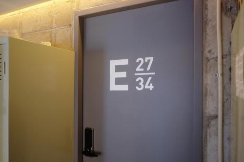 an elevator door with the number on it at The Cube Hotel in Seoul