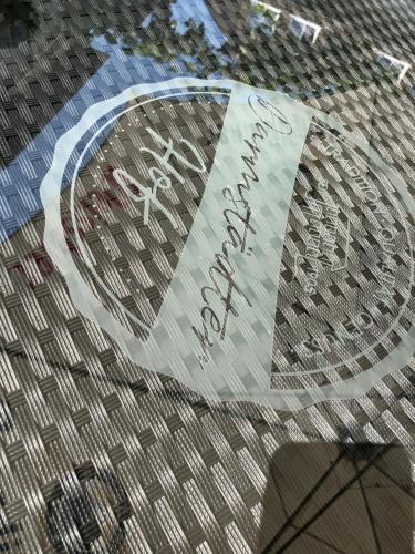 a sign on the side of a building with writing on it at Darmstädter Hof in Mainz