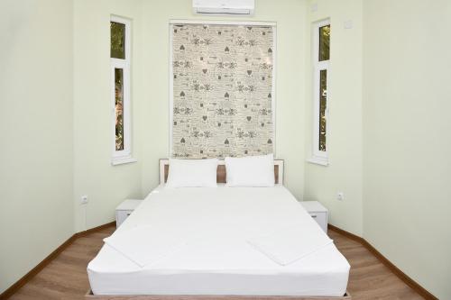 Ein Bett oder Betten in einem Zimmer der Unterkunft Apartament Shipka 2