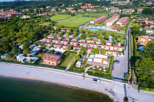 an aerial view of a resort near the beach at Onda Blu Resort in Manerba del Garda