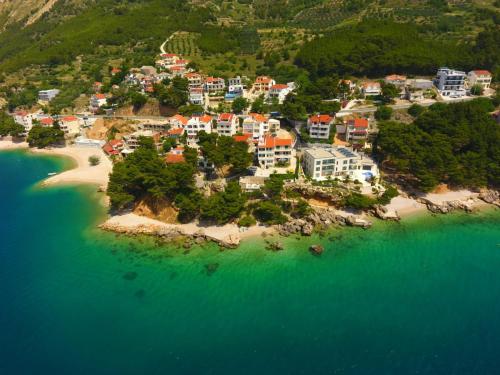 an aerial view of a resort on a beach at Apartmani Lučica in Mimice