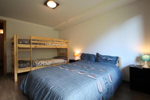 เตียงในห้องที่ Llorts, Casa Rustica, Ordino, Zona Vallnord