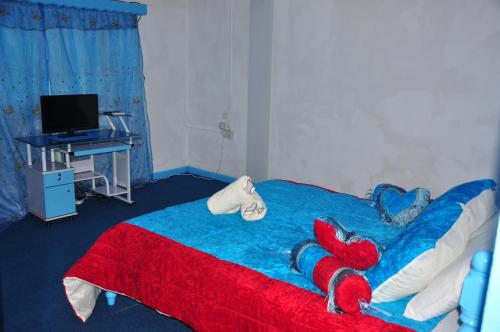Postel nebo postele na pokoji v ubytování Le Chateau Bleu