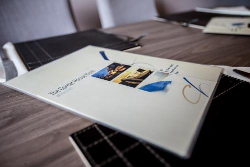 a magazine sitting on top of a table at Corner House Hotel Gatwick with bookable Holiday parking in Horley