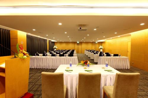 a banquet hall with tables and chairs in a room at Liberty Central Saigon Centre Hotel in Ho Chi Minh City