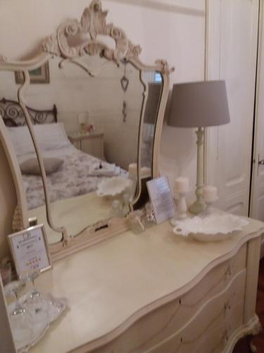 Postel nebo postele na pokoji v ubytování Novecento B&B