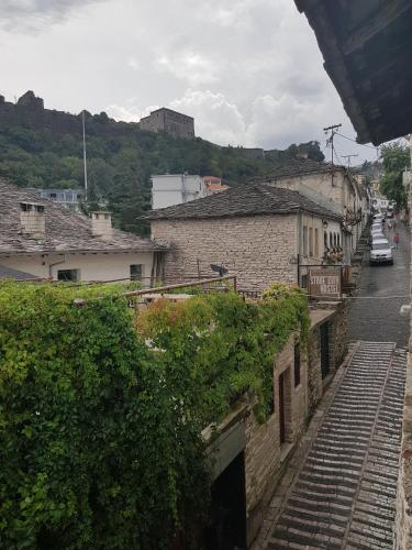 a stairway leading down a city street with buildings at Eva Guesthouse in Gjirokastër