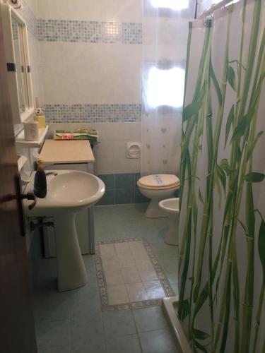 a bathroom with a sink and a toilet at Vacanze da Emanuele in Otranto