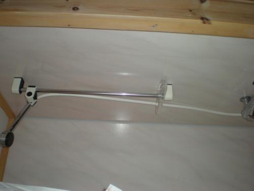 a metal towel rack on the wall of a bathroom at Karalaks in Lakselv