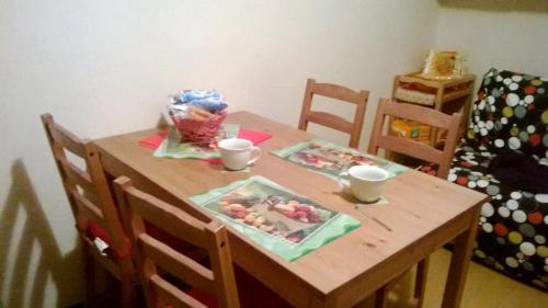 a wooden table with a table with food on it at Stephanie Home in Padova
