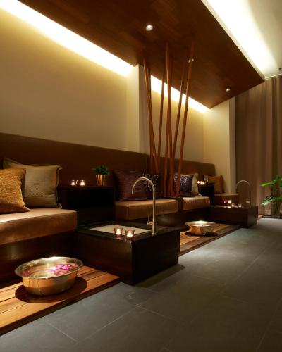a living room with a couch and a table at Let's Sea Hua Hin Al Fresco Resort in Hua Hin