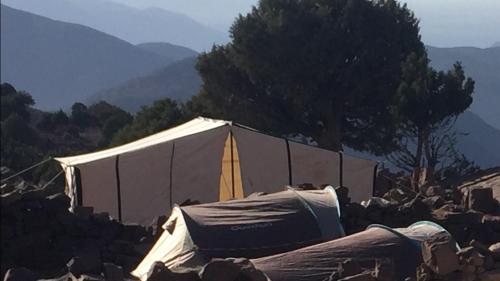 a group of tents in a pile of rocks at Chalet tizrag in Oukkainrdem