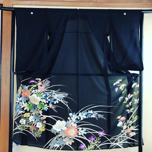 a bed with a blue canopy with flowers on it at HISAYO'S INN in Tokyo