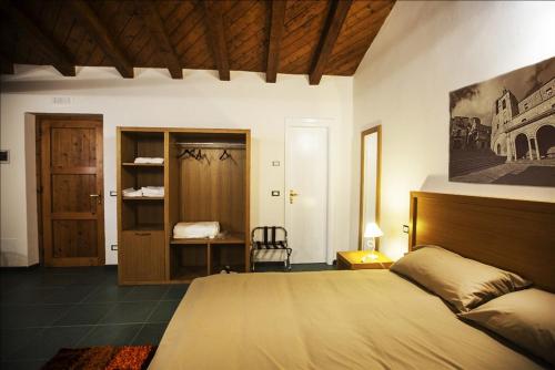 a bedroom with a large bed in a room at Antico Resort Cerasella in Petralia Soprana