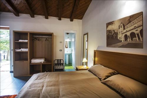 Кровать или кровати в номере Antico Resort Cerasella