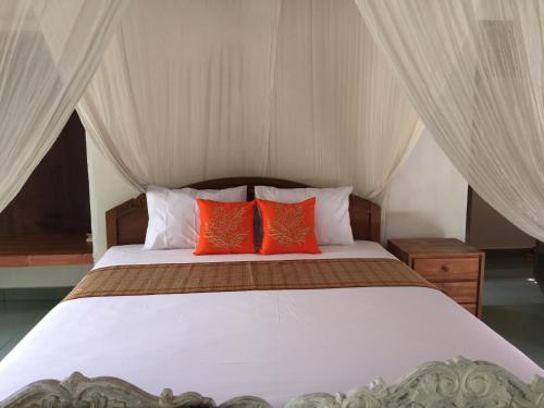 Una cama o camas en una habitación de Villa Mahesa