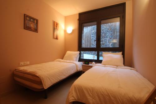En eller flere senge i et værelse på Salze, Canillo, Zona Grandvalira