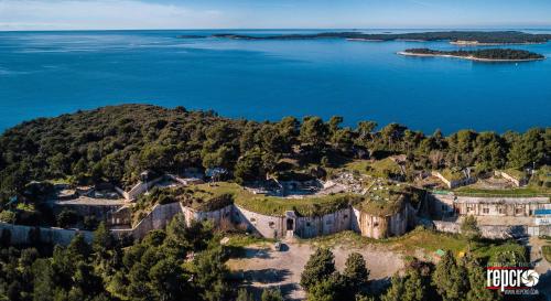 an aerial view of an island in a body of water at Guesthouse Adria in Pula