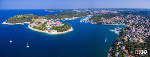 an island in the middle of a large body of water at Guesthouse Adria in Pula
