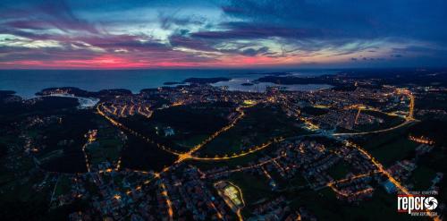 an aerial view of a city at night at Guesthouse Adria in Pula