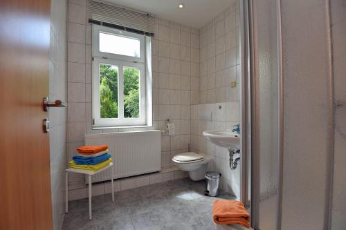 Ванная комната в Apartments und Bistro Zum Glasmacher
