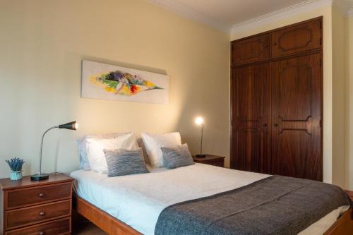 מיטה או מיטות בחדר ב-Offshore Rustic House