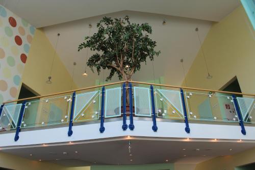 a tree on the second floor of a building at Hotel Holledau in Geisenhausen