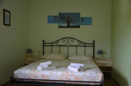 Een bed of bedden in een kamer bij 4 Racconti