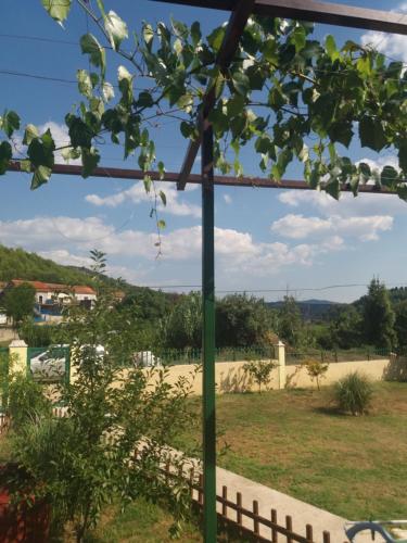 a view from a pergola looking out at a garden at Banin in Skradin