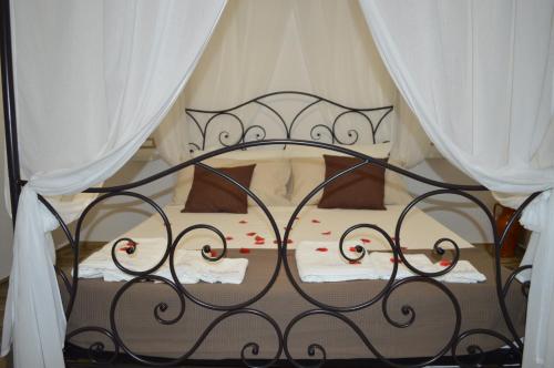 Ліжко або ліжка в номері Au Giardin