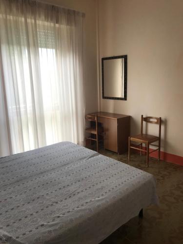 Postel nebo postele na pokoji v ubytování Albergo Villa Dionori