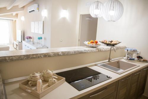 a kitchen with a sink and a counter at Attico in Canicattì