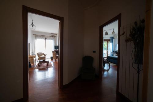 a hallway with two doors to a living room at B&B Villa Patrizia in Ercolano