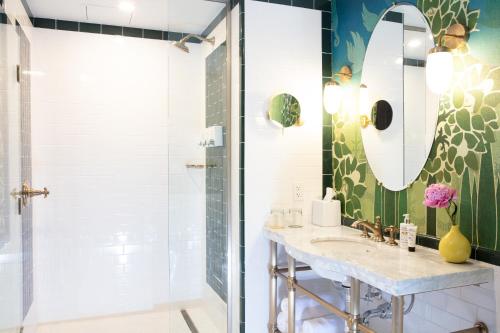 a bathroom with a sink and a mirror at Hotel Clermont Atlanta, by Oliver in Atlanta
