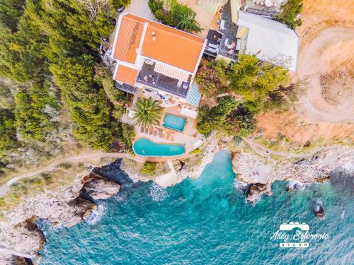 an aerial view of a villa and the ocean at Resort Stikovic in Dobra Voda