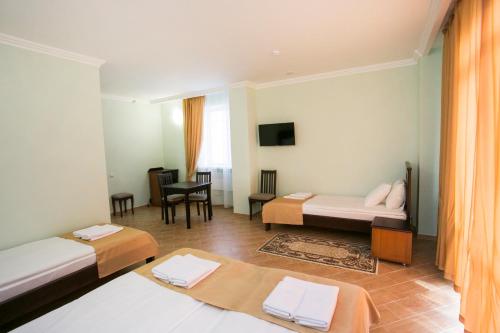 Postel nebo postele na pokoji v ubytování Hotel ACRA