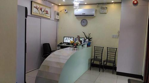 a waiting room with a long counter and chairs at Meaco Royal Hotel - Plaridel in Plaridel