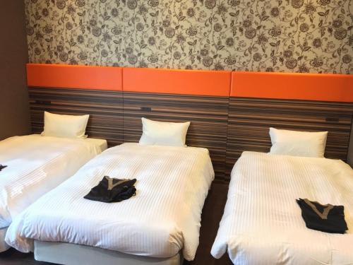 Postel nebo postele na pokoji v ubytování Hotel WBF Grande Hakata