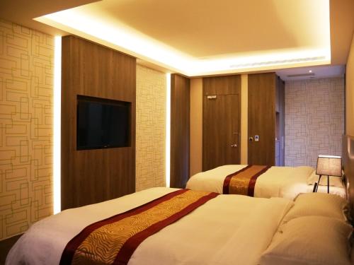Cama o camas de una habitación en Refinement Motel