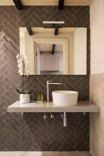 a bathroom with a sink and a mirror at Borgo De Chiari in Bologna