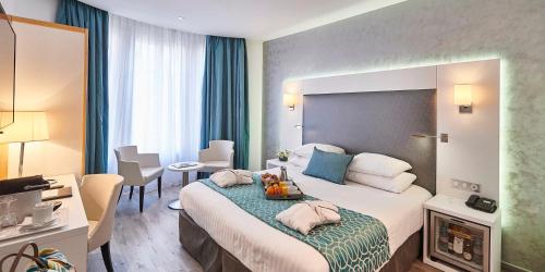 Ένα ή περισσότερα κρεβάτια σε δωμάτιο στο Best Western Plus Hotel Carlton Annecy